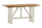 Wooden table with white legs on a white background
